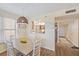 Cozy dining area with white chairs, pendant lighting, and a pass-through to the kitchen, creating a welcoming space at 4570 Pinebrook Cir # 508, Bradenton, FL 34209