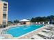 A community pool is a great spot to relax or get in a workout, surrounded by seating at 4570 Pinebrook Cir # 508, Bradenton, FL 34209
