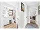 Well-lit bathroom with a white vanity, shower, and linen closet at 4612 Masefield Pl, Sarasota, FL 34241