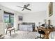 Bright bedroom with a daybed, workspace, and large window at 4612 Masefield Pl, Sarasota, FL 34241