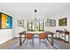 Dining room with modern lighting and eclectic artwork at 4612 Masefield Pl, Sarasota, FL 34241