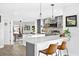 An eat-in kitchen featuring counter seating, modern lighting, and grey color palate at 4612 Masefield Pl, Sarasota, FL 34241