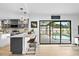 Open kitchen showcasing counter seating and sliding glass doors leading to the pool area at 4612 Masefield Pl, Sarasota, FL 34241