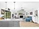 Bright living room featuring a stone fireplace, wood floors, and comfortable seating with outdoor access at 4612 Masefield Pl, Sarasota, FL 34241