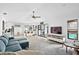 Bright living room featuring an open floor plan and access to the outdoor pool area at 4612 Masefield Pl, Sarasota, FL 34241