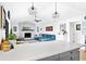Open floor plan with kitchen looking out into the living room featuring a fireplace at 4612 Masefield Pl, Sarasota, FL 34241