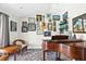 Cozy room featuring a vintage piano, eclectic artwork, and inviting decor at 4612 Masefield Pl, Sarasota, FL 34241