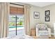 The main bedroom features backyard views, natural light, and a comfortable seating area at 4612 Masefield Pl, Sarasota, FL 34241