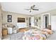 Main bedroom featuring neutral tones, a walk-in closet, backyard views, and comfortable sitting area at 4612 Masefield Pl, Sarasota, FL 34241