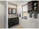 Bathroom featuring a vanity with storage and a shower stall, with neutral colors at 4758 Breezy Pines Blvd, Sarasota, FL 34232