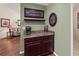 This coffee bar area features granite countertops, dark cabinetry and is the perfect place to start your day at 4758 Breezy Pines Blvd, Sarasota, FL 34232