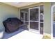Exterior view of the screened lanai, showcasing access to indoor/outdoor living at 4758 Breezy Pines Blvd, Sarasota, FL 34232
