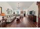 Spacious living room with hardwood floors, neutral tones, and comfortable seating at 4758 Breezy Pines Blvd, Sarasota, FL 34232