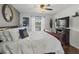 Comfortable main bedroom featuring a king-size bed and natural lighting at 4758 Breezy Pines Blvd, Sarasota, FL 34232