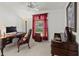 Functional home office with a desk, chair, and plenty of natural light at 4758 Breezy Pines Blvd, Sarasota, FL 34232