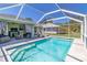 Covered outdoor pool with blue-and-white striped curtains, outdoor furniture, and blue tile at 4758 Breezy Pines Blvd, Sarasota, FL 34232