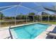 Beautiful pool area with a fountain, offers a refreshing oasis with scenic views at 4758 Breezy Pines Blvd, Sarasota, FL 34232