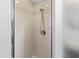 The bathroom features a tiled shower with modern fixtures and a sleek glass door at 4758 Breezy Pines Blvd, Sarasota, FL 34232