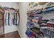 Spacious walk-in closet with shelving and rods for clothes storage at 4758 Breezy Pines Blvd, Sarasota, FL 34232