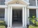 Inviting entrance with classic columns leads to the stairway of this charming building at 4802 51St W St # 1724, Bradenton, FL 34210