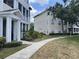 Exterior view showcasing the building's facade and landscaped walkway at 4802 51St W St # 1724, Bradenton, FL 34210