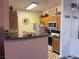 Cozy kitchen featuring ample cabinetry, black countertops, and modern appliances at 4802 51St W St # 1724, Bradenton, FL 34210