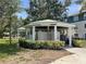 Community mail kiosk area with individual mailboxes and verdant landscaping at 4802 51St W St # 1724, Bradenton, FL 34210