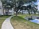 Scenic view of the pond surrounded by lush greenery and condo buildings at 4802 51St W St # 1724, Bradenton, FL 34210