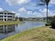 Scenic view of the complex pond with buildings in the background on a sunny day at 4802 51St W St # 1724, Bradenton, FL 34210