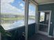 Inviting screened porch overlooking a peaceful pond and lush landscape at 4802 51St W St # 1724, Bradenton, FL 34210