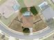 Aerial view showcasing property lines of home featuring a screened pool and surrounding landscaping at 4951 Brightstone Pl, Spring Hill, FL 34609
