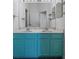 Turquoise double sink vanity with marble countertop in a naturally lit bathroom at 4951 Brightstone Pl, Spring Hill, FL 34609