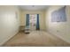 Bright bedroom with light yellow walls, window, and small desk, ready for personalization at 4951 Brightstone Pl, Spring Hill, FL 34609