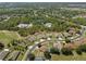 Community aerial view showcasing neighborhood amenities, mature trees, and residential homes at 4951 Brightstone Pl, Spring Hill, FL 34609