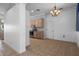 View of the dining area and kitchen showcasing open floor plan, tile floors and light filled space at 4951 Brightstone Pl, Spring Hill, FL 34609