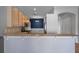 Open kitchen with granite countertops, stainless steel appliances and a breakfast bar at 4951 Brightstone Pl, Spring Hill, FL 34609