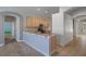 Well-lit kitchen with granite countertops, breakfast bar, and seamlessly connected to the living room at 4951 Brightstone Pl, Spring Hill, FL 34609