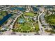 Community aerial featuring manicured lawns, playgrounds, winding walkways, and relaxing lakes for outdoor enjoyment at 5020 Torrey Pines Run, Bradenton, FL 34211