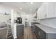 Beautiful modern kitchen with stainless steel appliances, sleek countertops, and bar stools at 5020 Torrey Pines Run, Bradenton, FL 34211