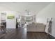 Spacious living room with dark wood floors and scenic views of the lake at 5020 Torrey Pines Run, Bradenton, FL 34211