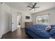 A main bedroom features a ceiling fan, TV, and a large window looking out to the water at 5020 Torrey Pines Run, Bradenton, FL 34211