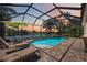 Stunning screened pool and spa with lake views, perfect for outdoor living and entertaining at 5020 Torrey Pines Run, Bradenton, FL 34211