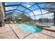 Beautiful screened-in pool and spa with views of the tranquil lake at 5020 Torrey Pines Run, Bradenton, FL 34211