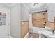 Bathroom features tiled shower/tub combination and a modern vanity at 513 25Th W Ave, Bradenton, FL 34205