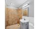 Modern bathroom features tiled shower, a single sink vanity and neutral decor at 513 25Th W Ave, Bradenton, FL 34205