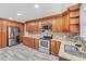 Updated kitchen with stainless steel appliances, granite countertops, and ample cabinet space at 513 25Th W Ave, Bradenton, FL 34205