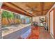 Covered patio with tile floor, ceiling fans, storage shed, laundry and exercise equipment at 513 25Th W Ave, Bradenton, FL 34205