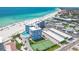 Aerial view of a beachfront condominium featuring pool, tennis court, and stunning ocean views at 5300 Gulf Dr # 501, Holmes Beach, FL 34217