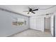 Bright bedroom with tile flooring, closet, and a large window offering neighborhood views at 5300 Gulf Dr # 501, Holmes Beach, FL 34217