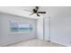 Bedroom features a ceiling fan and a large window with an ocean view at 5300 Gulf Dr # 501, Holmes Beach, FL 34217